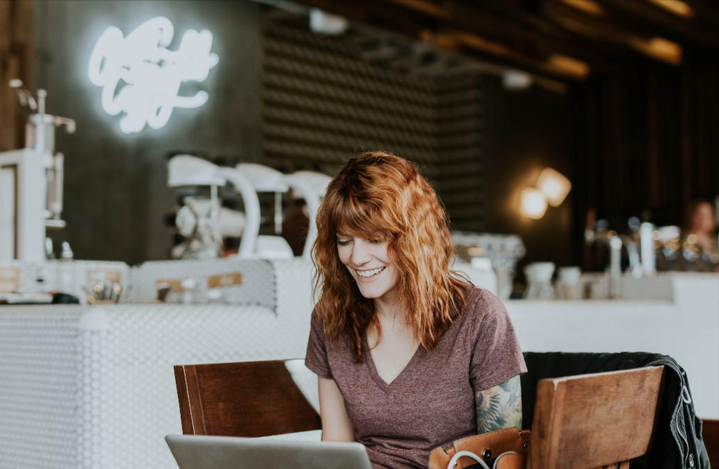 Source: https://unsplash.com/photos/woman-sitting-on-brown-wooden-chair-while-using-silver-laptop-computer-in-room-WHWYBmtn3_0